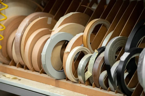 Rolls of wood edges in assorted woods — Stock Photo, Image