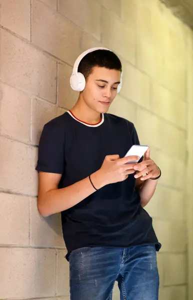 Young Teenage Man Listening Music Town Standing Leaning Wall Selecting — Stock Photo, Image