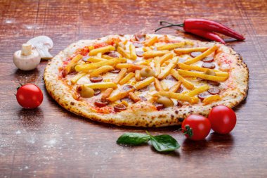 Pizza with french fries and sausage. Appetizing pizza with sausage, cheese and potatoes clipart