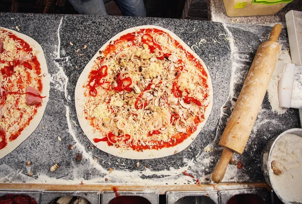 In the kitchen of chef. Master class on cooking pizza — Stock Image In the kitchen of chef. Master class on cooking pizza Stock Image