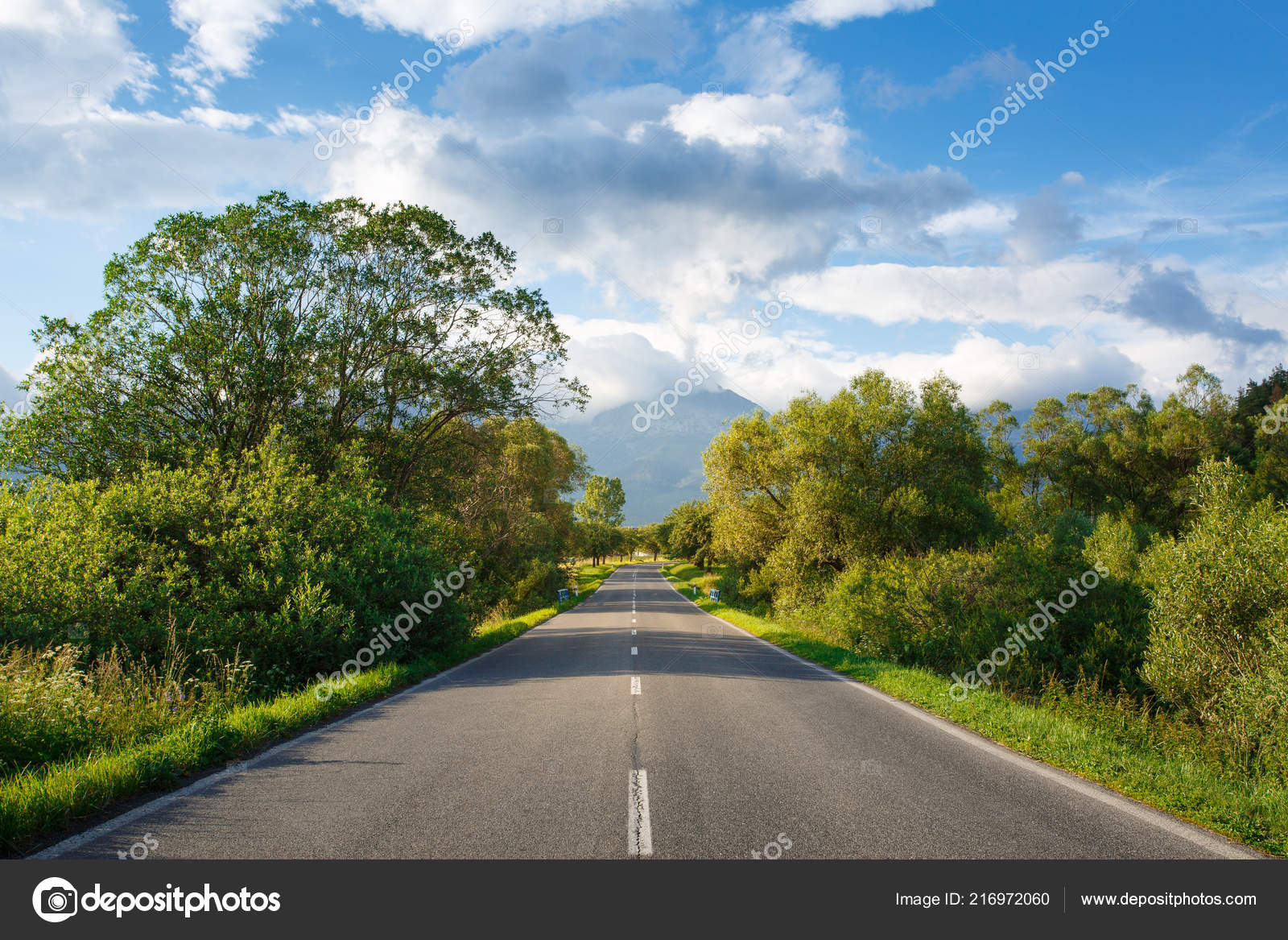 Scenic view from asphalt road against the background of mountains Stock  Photo by ©serkucher 216972060