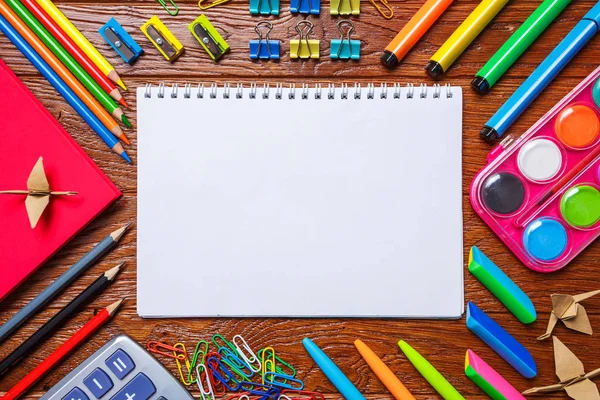 The school stationery and paper origami are laid out around the place for the text — Stock Photo, Image