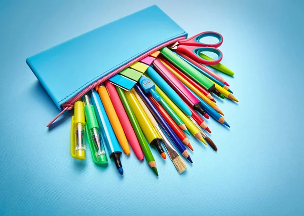 The pencil case is filled with pens, pencils and stickers. — Stock Photo, Image