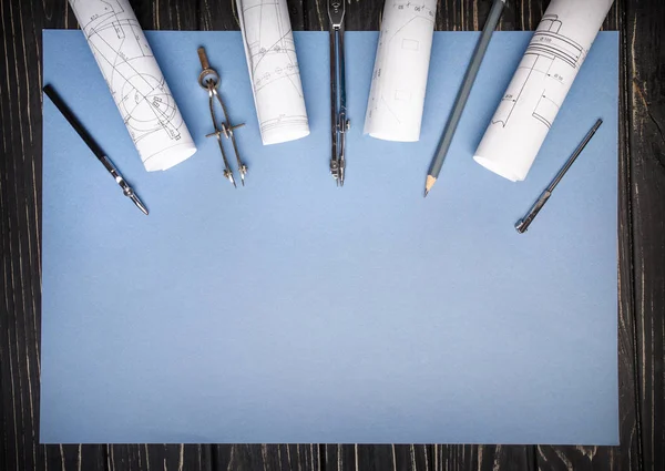 Compasses, rulers from the drawing and a pencil on a blue backgr — Stock Photo, Image