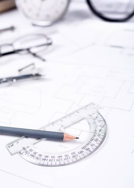 Pencil with a protractor against the background of the engineer'