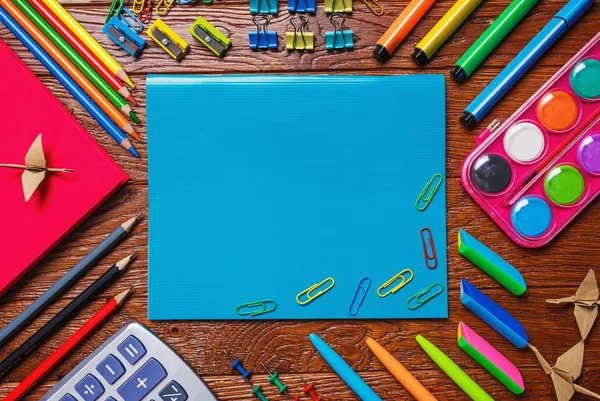Bright stationery is laid out around the notebook — Stock Photo, Image