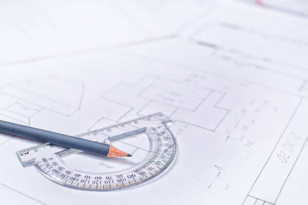 Gray pencil with a protractor in the drawings