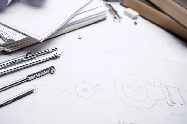 A stack of industrial drawings, books and compasses — Stock Photo, Image