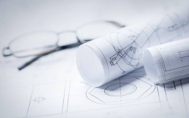 Arka planda gözlüklü çizimlerin ruloları