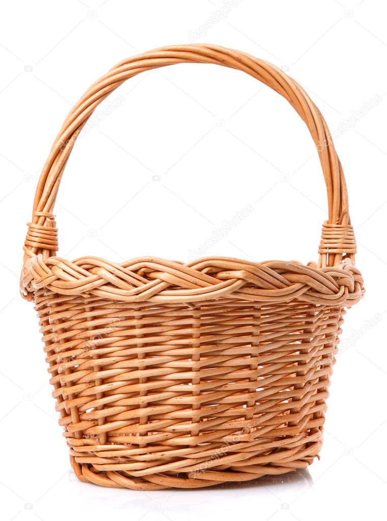 Big wicker basket on a white background. The basket is made of vines.