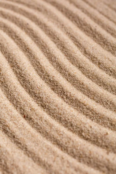 Sand Texture. Brown sand. Background from fine sand. Sand background. Waves texture.