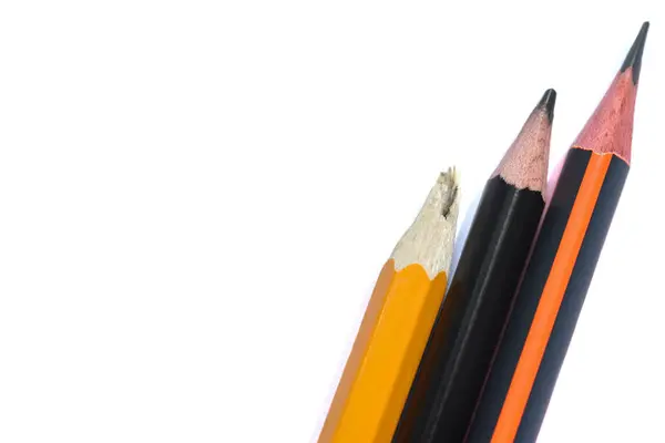 Three isolated graphite simple pencils on a white background close-up. Pencil broken — Stock Photo, Image