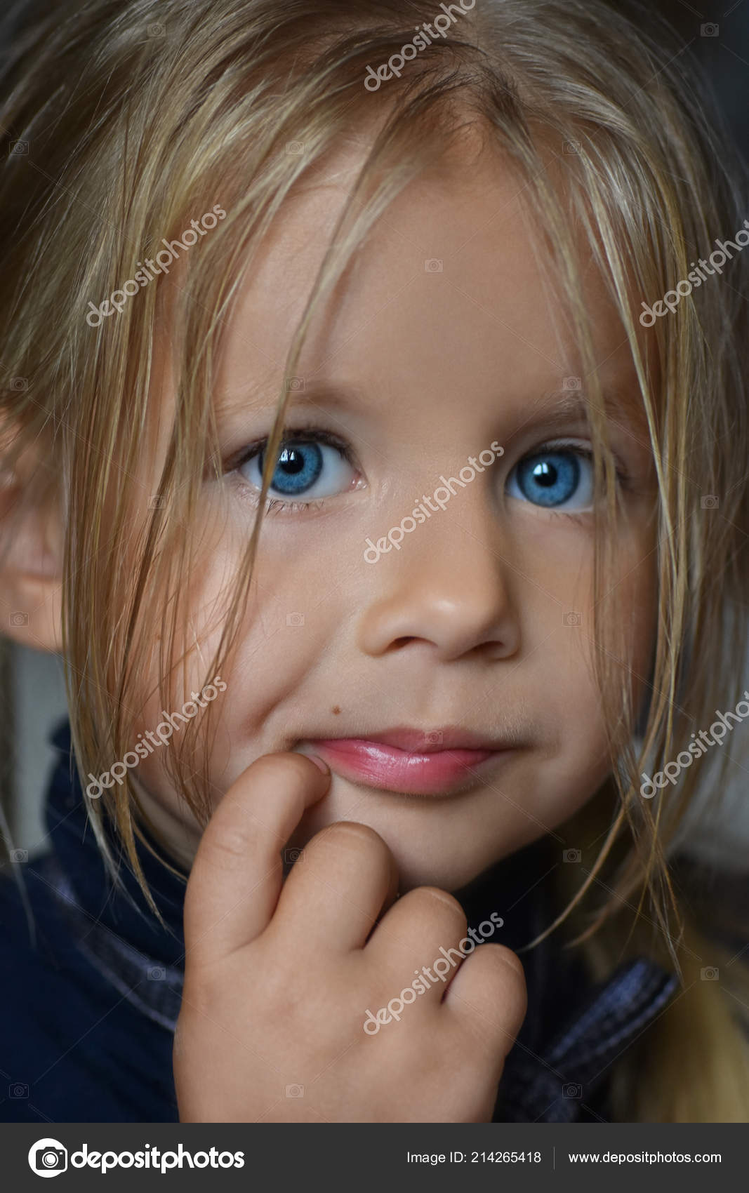 Studio portrait of a small serious white girl with white hair and blue eyes  Stock Photo by ©aleksandrbs 214265418