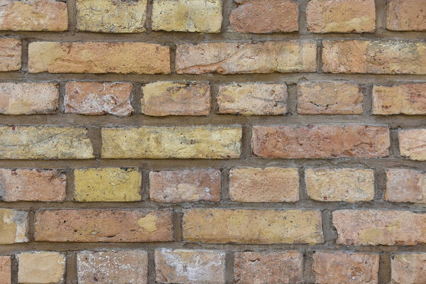 Текстура старой кирпичной стены из желтого кирпича
