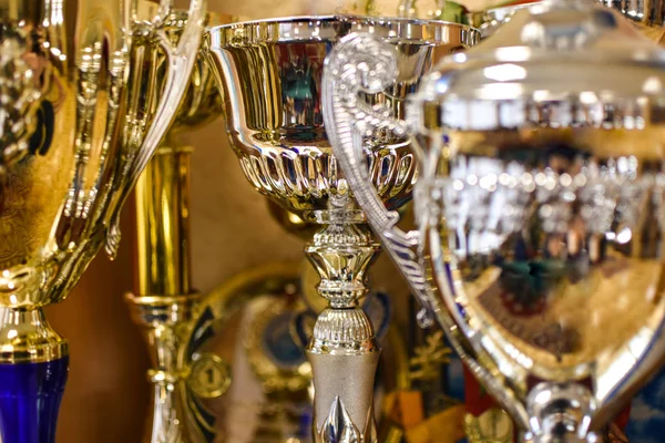 Silver and gold sports cups, close-up