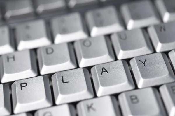 A palavra play das letras nos botões do teclado — Fotografia de Stock