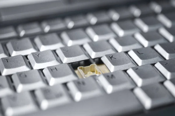 Broken button on a computer keyboard, close-up