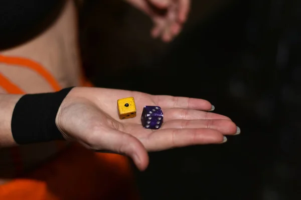The player rolls the dice in the quest game