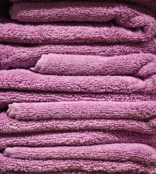Purple terry towels in the hotel — Stock Photo, Image