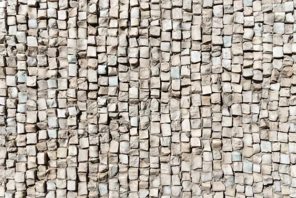 Textur aus farbigem Steinmosaik an der Wand — Stockfoto