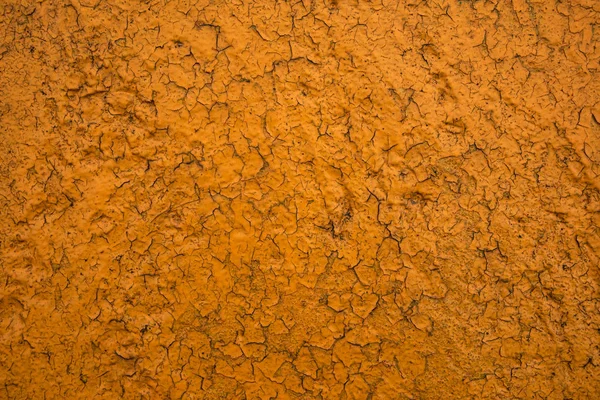 Texturen av den gamla krackelerad gula färgen på väggen — Stockfoto