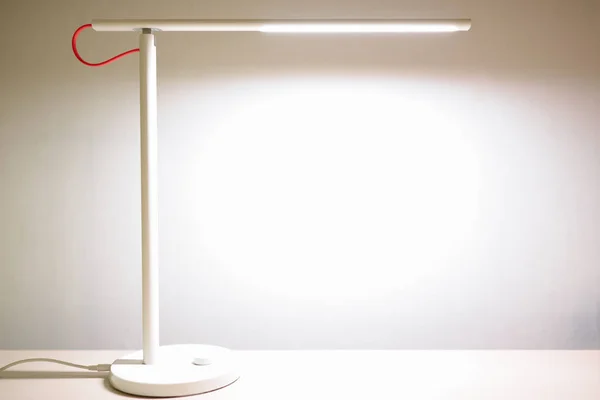 LED lamp shines brightly on the desktop