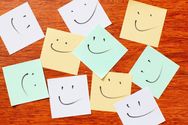 Notepad, paper, pen, pencil for study or work in the office. Isolated on wooden background.