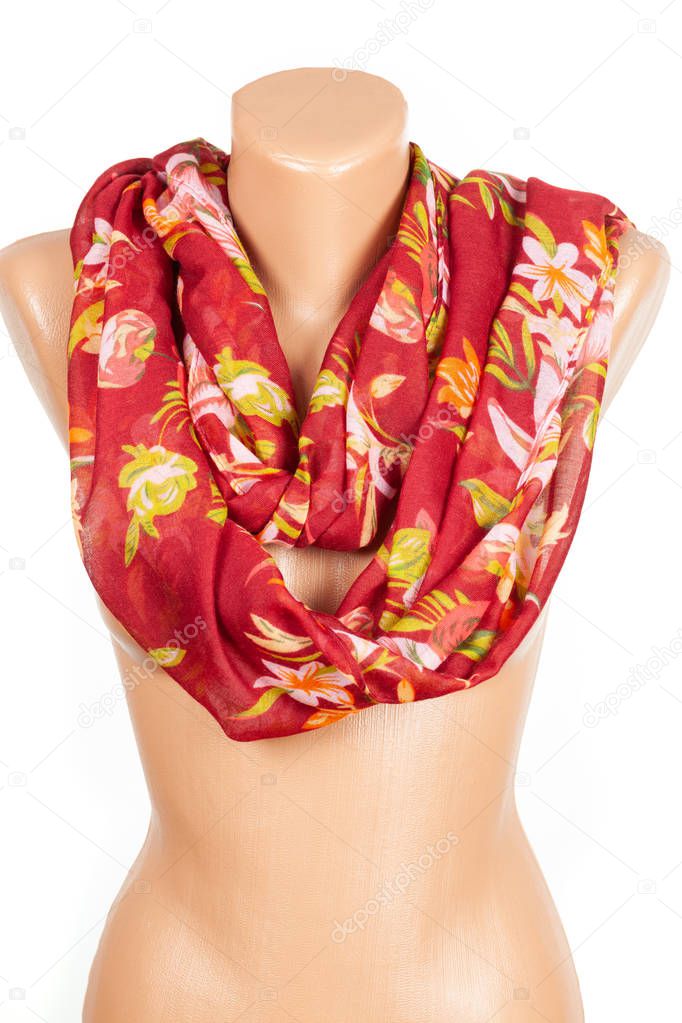 Red silk scarf on mannequin isolated on white background.