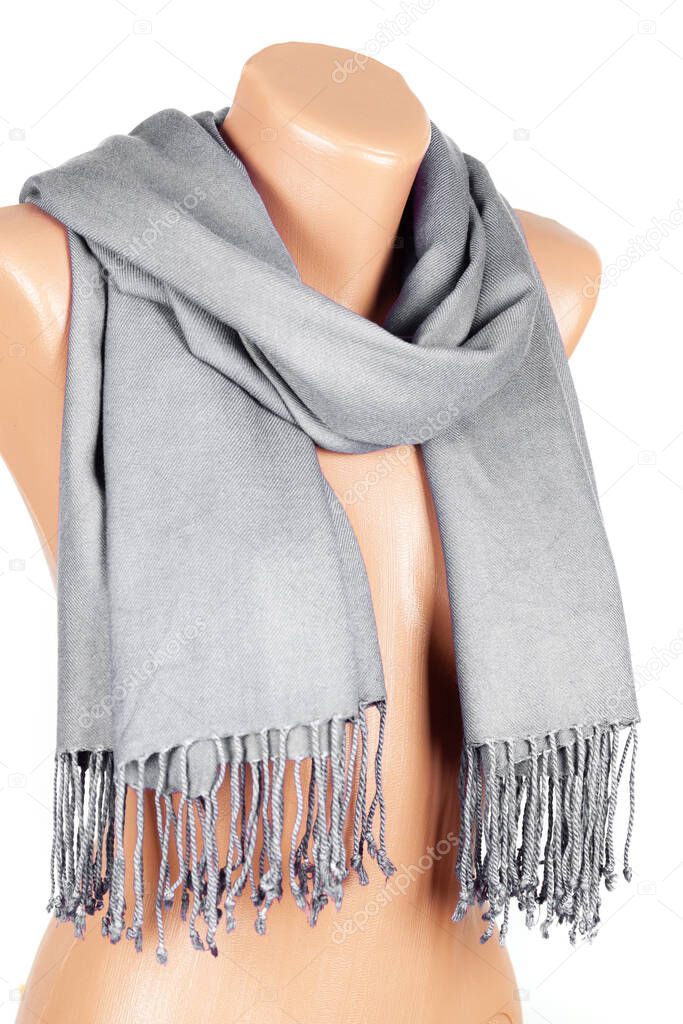 Gray scarf on mannequin isolated on white background. Female accessory.