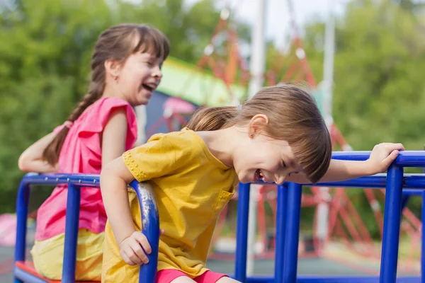 Two Little Girls Laughting Swing Park — Stock Photo, Image