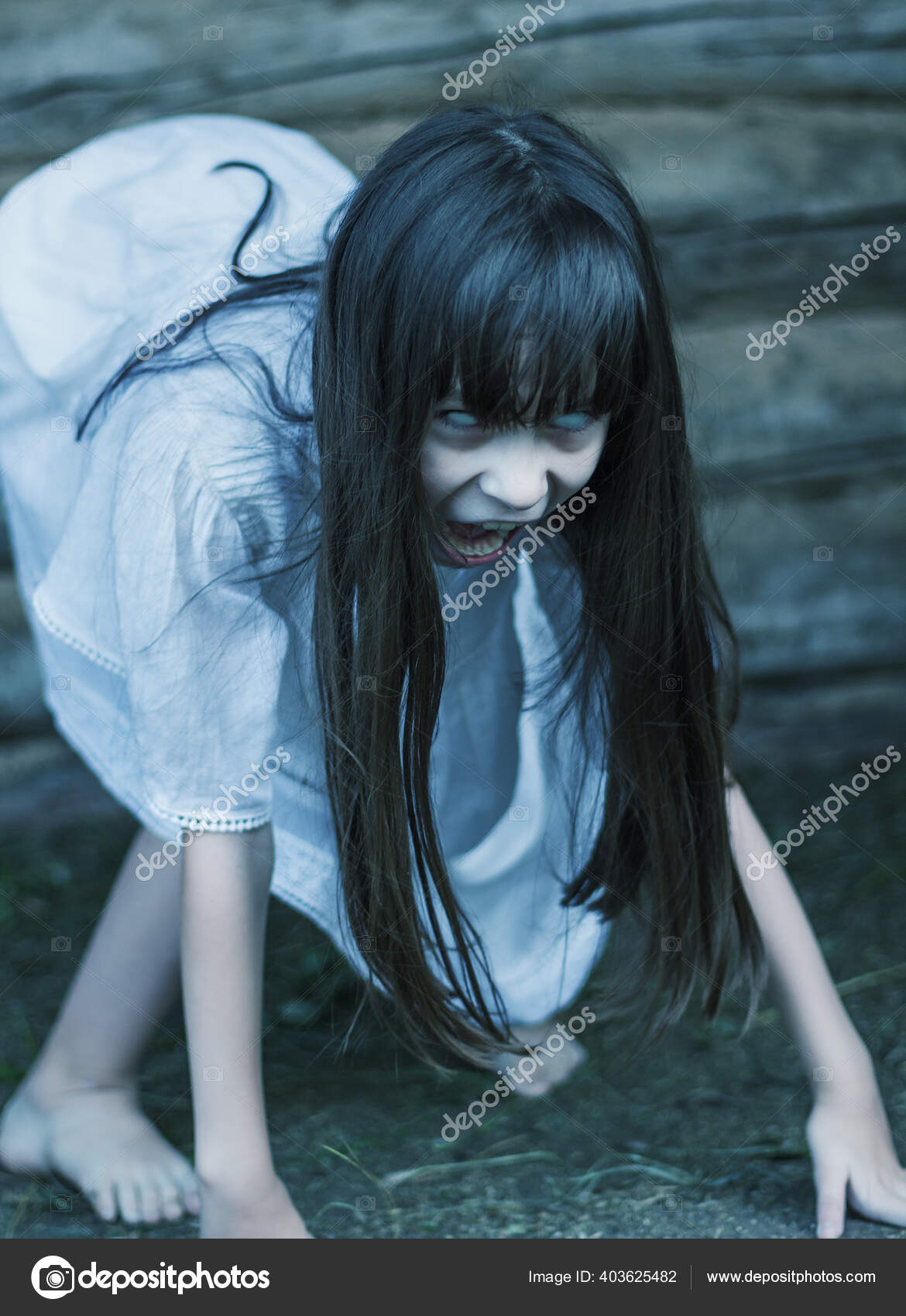 Scary Ghost Girl Long Black Hair Openes Mouth Hisses Crept Stock Photo by  ©bertoszig 403625482