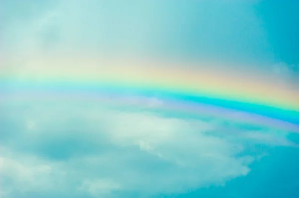 stock image rainbow against the sky and clouds