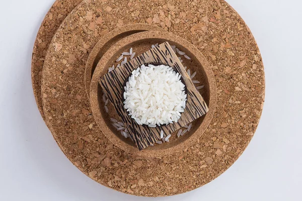 Raw and uncooked rice in basket weave,shallow Depth of Field,Focus on rice.
