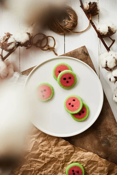 Watermelon slice cookies recipe on background