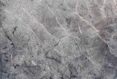 Çizikler ve çatlaklar ile taş doku parçası. Doğal arka plan.