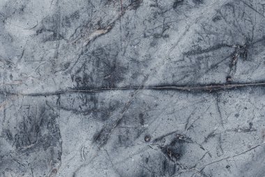 Çizikler ve çatlaklar ile taş doku parçası. Doğal arka plan.