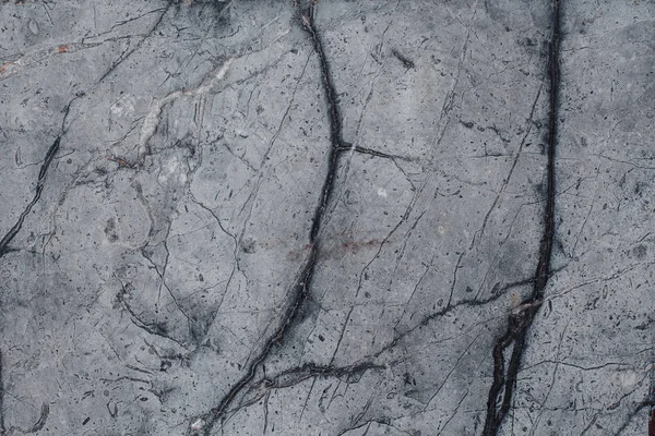 Çizikler ve çatlaklar ile taş doku parçası. Doğal arka plan.