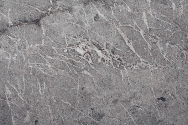 Fragment of stone texture with scratches and cracks. Natural Background.