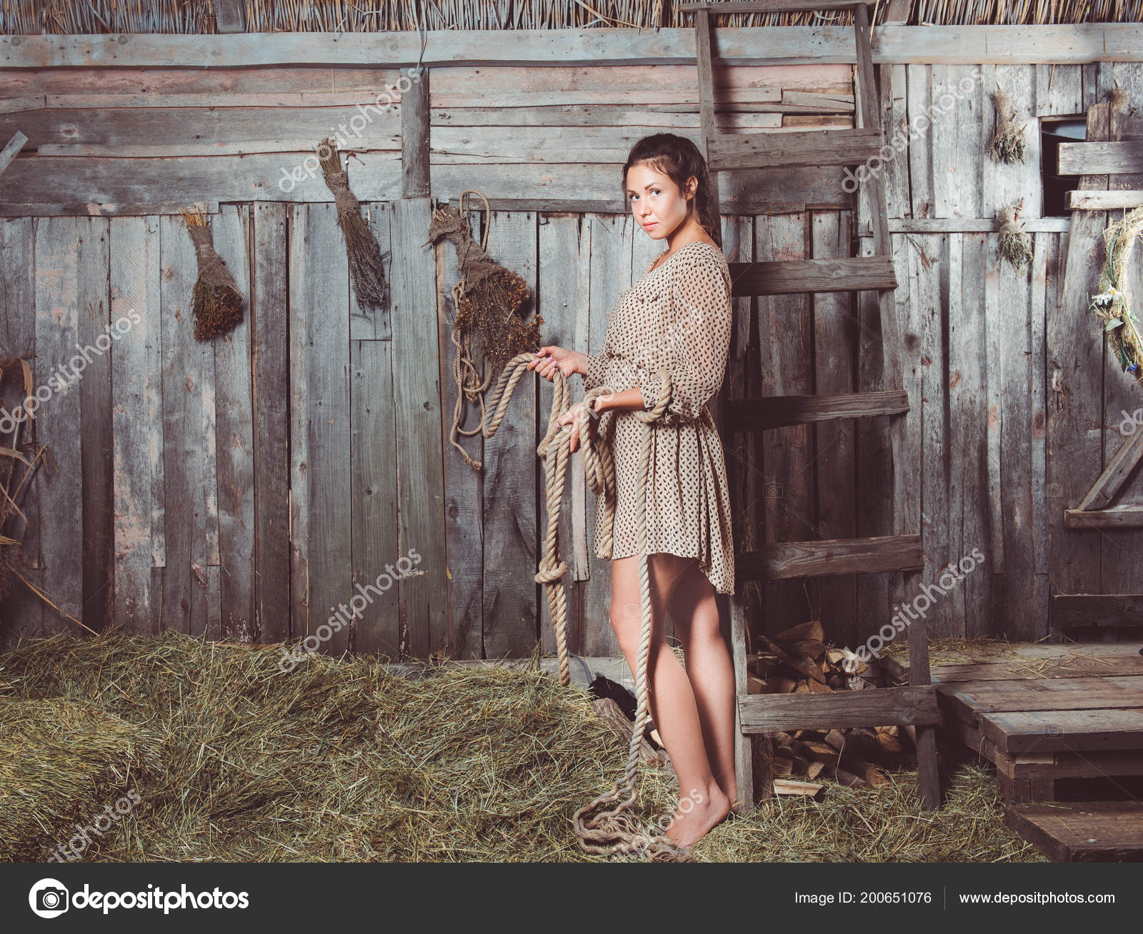 https://st4.depositphotos.com/17877862/20065/i/1600/depositphotos_200651076-stock-photo-young-girl-barn-rope-her.jpg