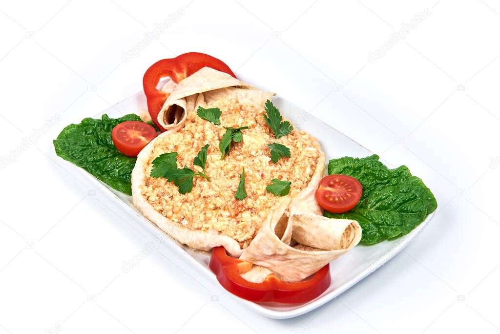 Fried eggs in pita bread on a plate on white background. Serving dishes in a cafe, restaurant, for a menu.