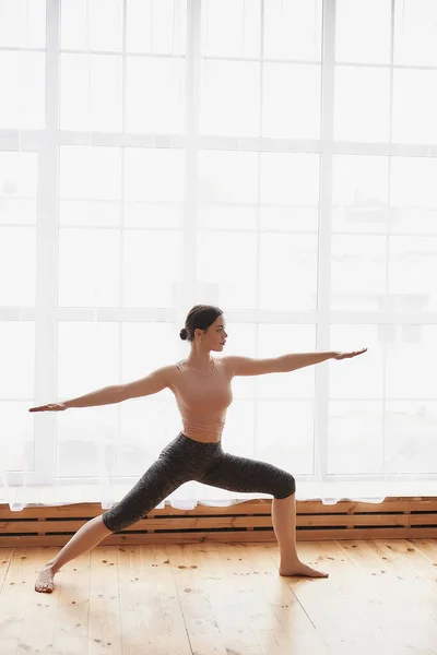 Young Woman Practice Yoga Stretching Exercise Standing Warrior Pose Home — Stock Photo, Image