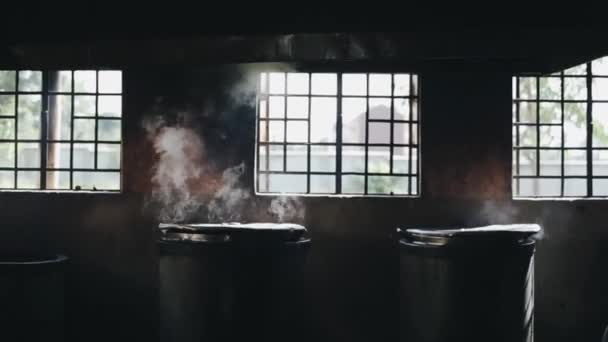 Smoking pots in the kitchen near the window. Food is cooked in big boilers with cap. — Stock Video