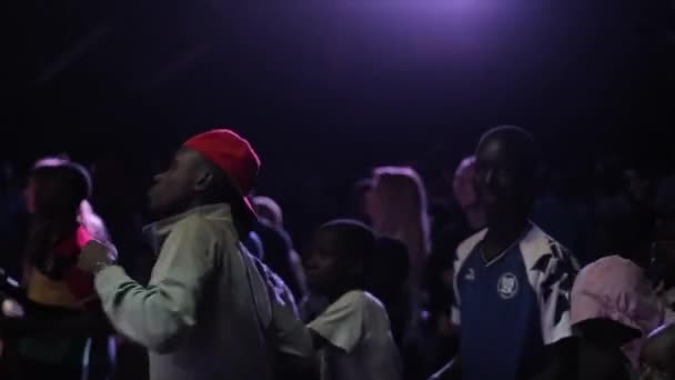 KENYA, KISUMU - MAY 20, 2017:Group of African children, teenagers dancing in the evening together, smiling and clapping hands. — Stock Video