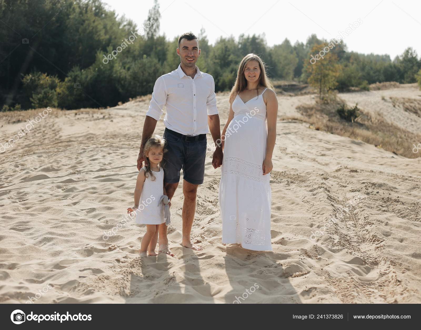 Portrait Of Caucasian Family With Baby In White Clothes Are Standing On Sands Dune Pregnant Mpther Newborn Stock Photo Image By C Sergey Orlov Bobr Gmail Com 241373826