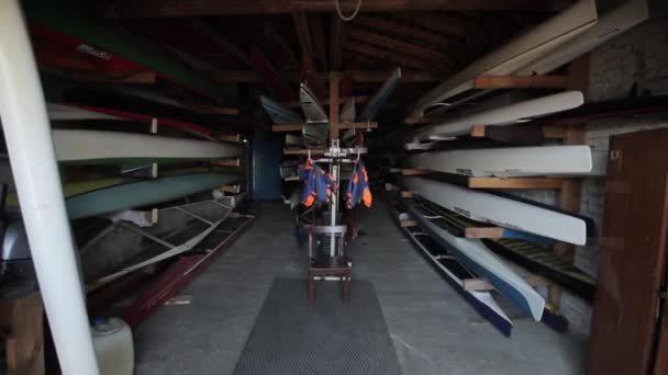 Bobruisk, Belarus - 11 May 2019: canoe and kayak warehouse. Collection of vibrant colorful plastic recreational canoe and kayaks. — Stock Video