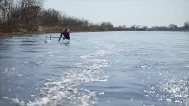 Disabled man rowing on the river in a canoe. Rowing, canoeing, paddling. Training. Kayaking. paraolympic sport — Stock Video