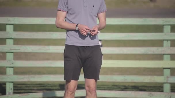 Bobruisk, Belarus - 15 June 2019: soccer coach holding whistle in hand. — Stock Video