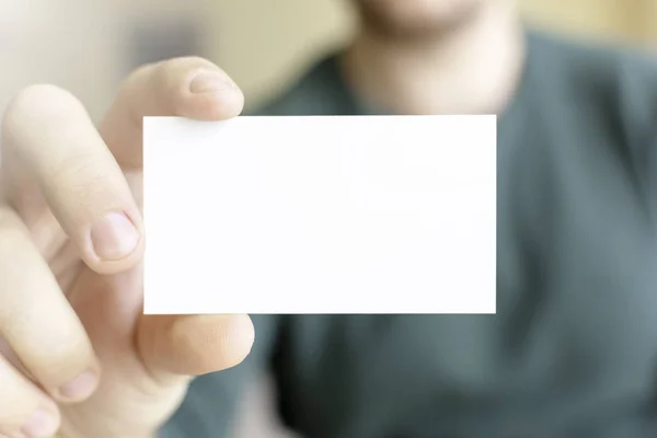 Business Card Mock-Up - Man Holding a Blank Card for Clients. Business Card Template.
