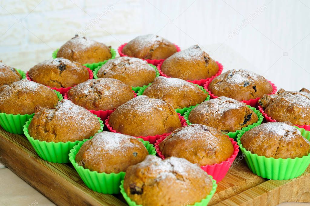 Muffins with powdered sugar baked in silicone molds.