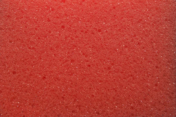 Текстура пористой поверхности губки красная. . — стоковое фото